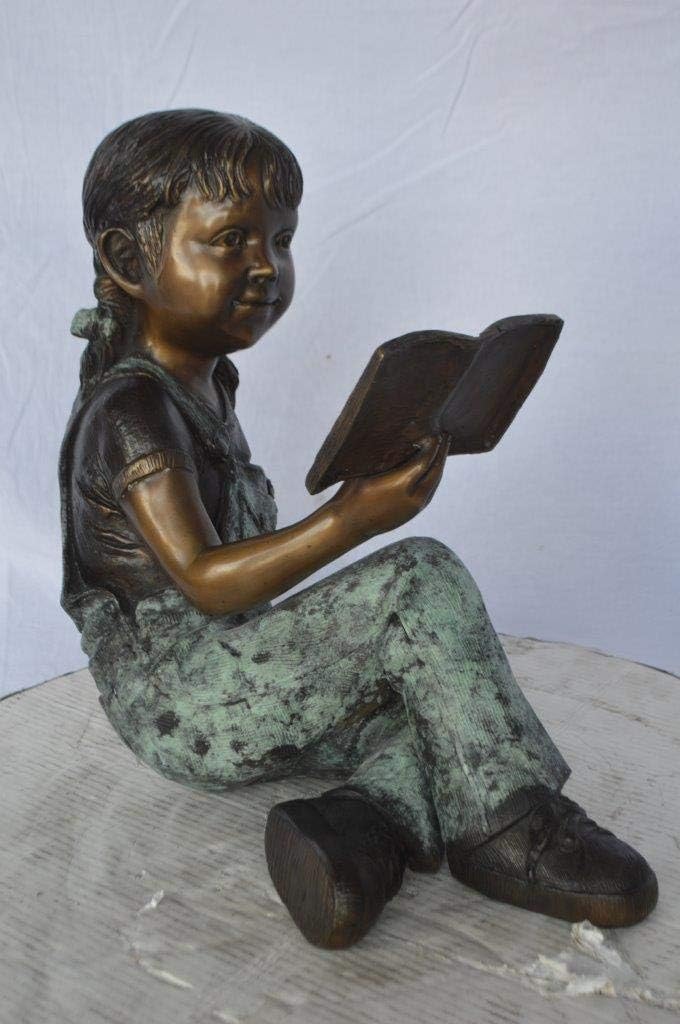 Young Girl Laying and Reading Book Bronze Statue - Size: 18" L x 9" W x 16" H.